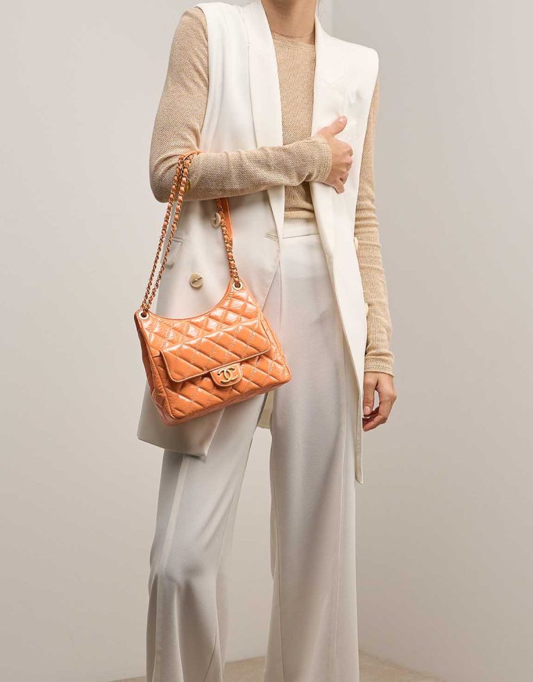 Chanel Hobo Aged Calf Orange on Model | Sell your designer bag