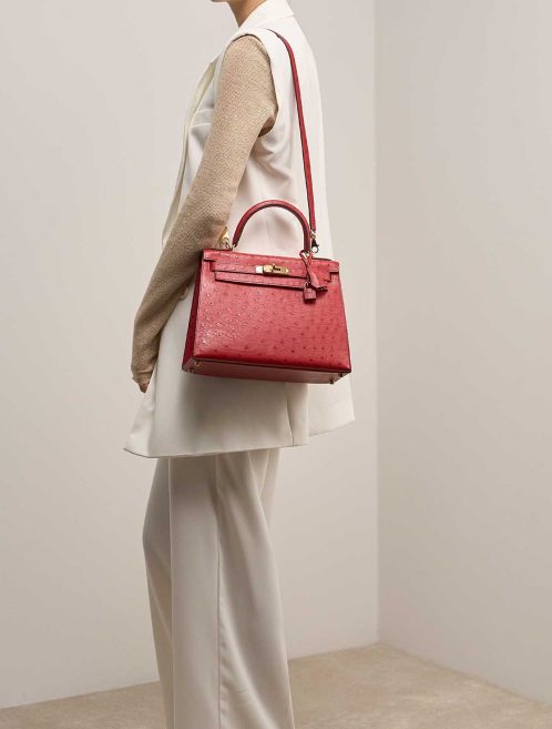 Hermès Kelly 28 Ostrich Rouge Vif on Model | Sell your designer bag