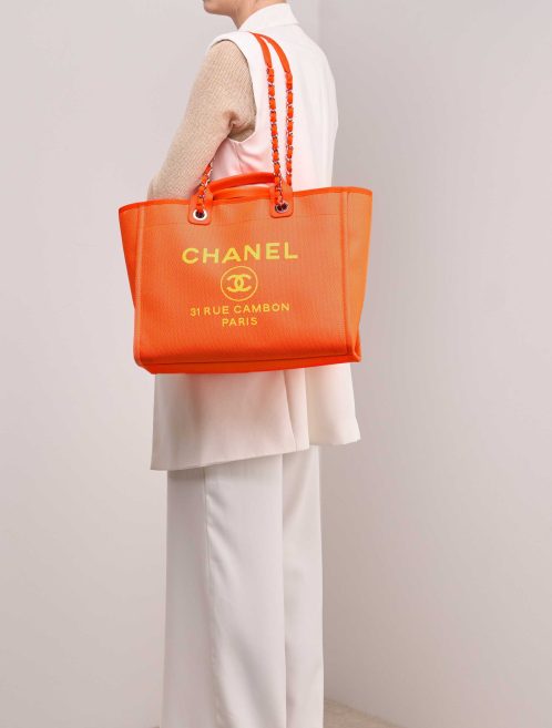 Chanel Deauville Large Canvas Neon Orange / Neon Yellow on Model | Sell your designer bag