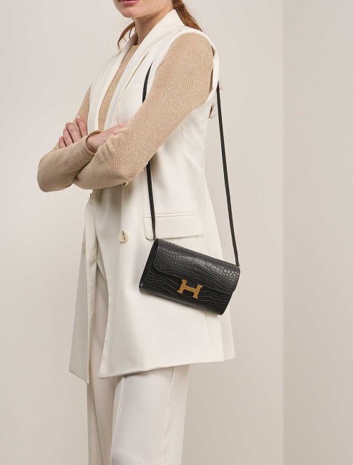 Hermès Constance To Go Alligator Mississippi Black on Model | Sell your designer bag