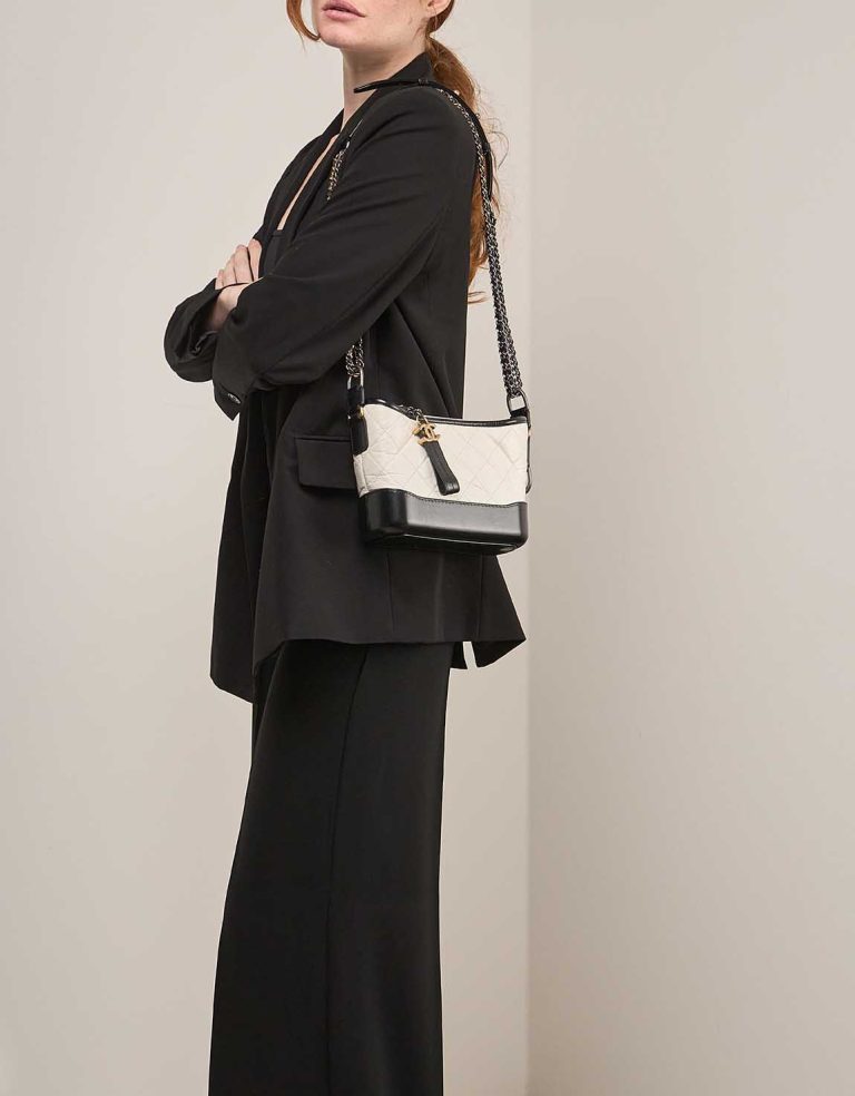 Chanel Gabrielle Small Aged Calf / Lamb Black / White on Model | Sell your designer bag