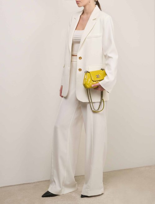 Chanel Timeless Single Flap Patent Yellow on Model | Sell your designer bag