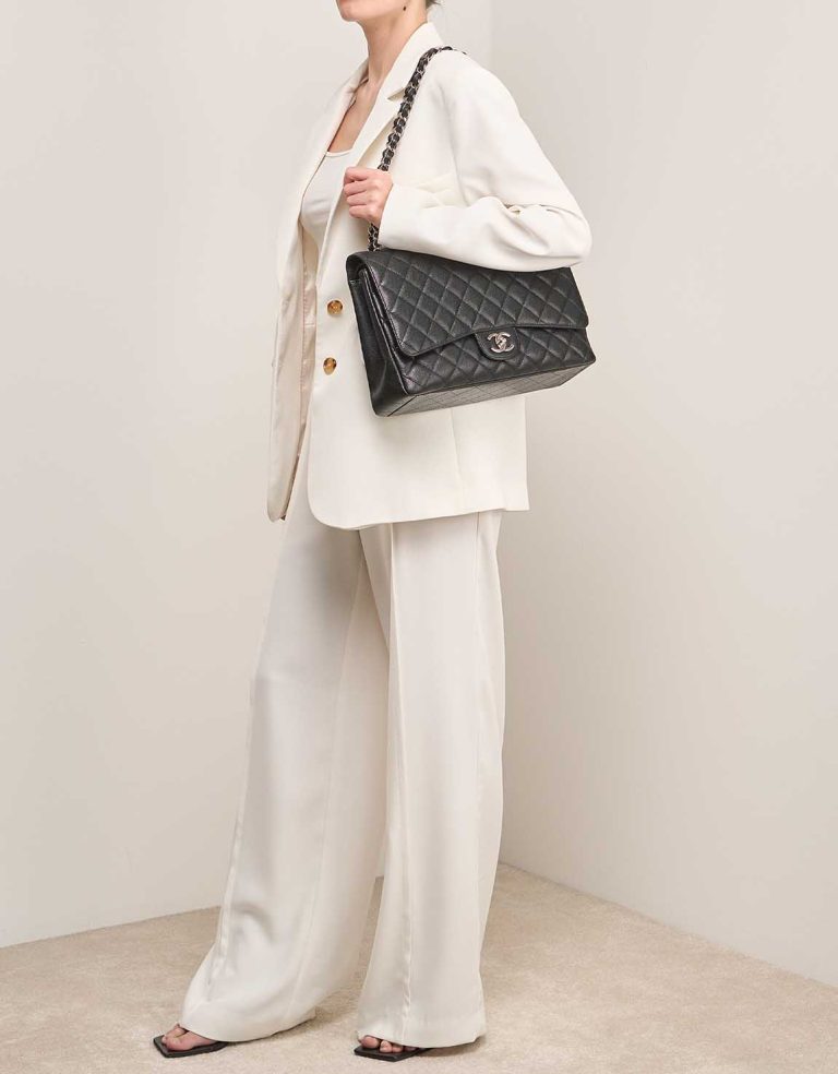 Chanel Timeless Maxi Caviar Black on Model | Sell your designer bag