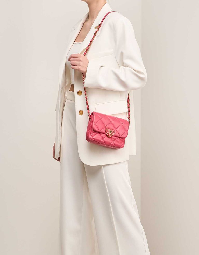 Chanel Coco Love Flap Bag Mini Lamb Pink on Model | Sell your designer bag