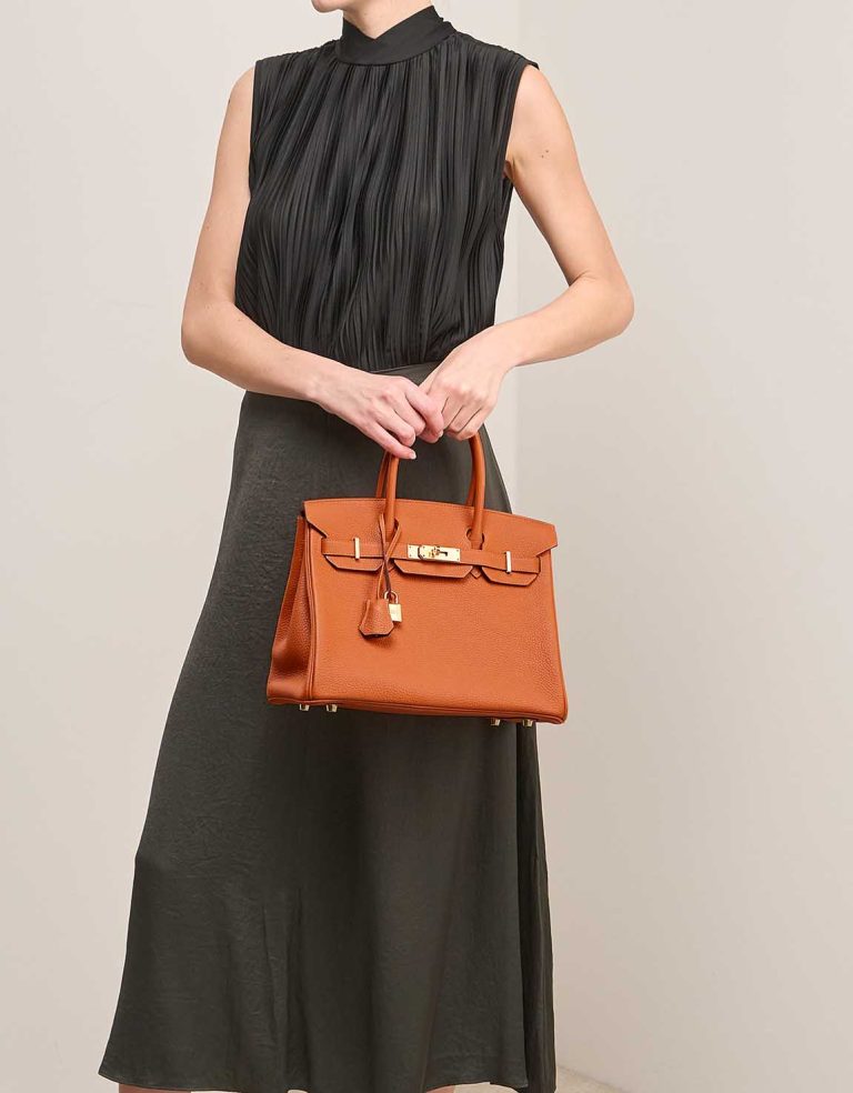 Hermès Birkin 30 Togo Orange  on Model | Sell your designer bag